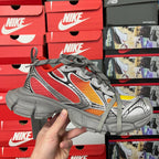 Red, gray and yellow mesh sneaker with gray laces and chunky tread sole