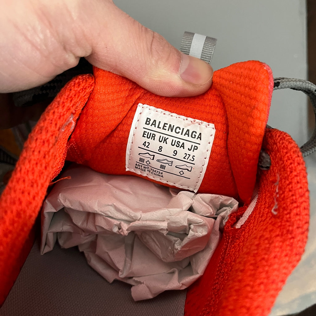 Orange interior tag reading BALENCIAGA, size 42, on sneaker lining