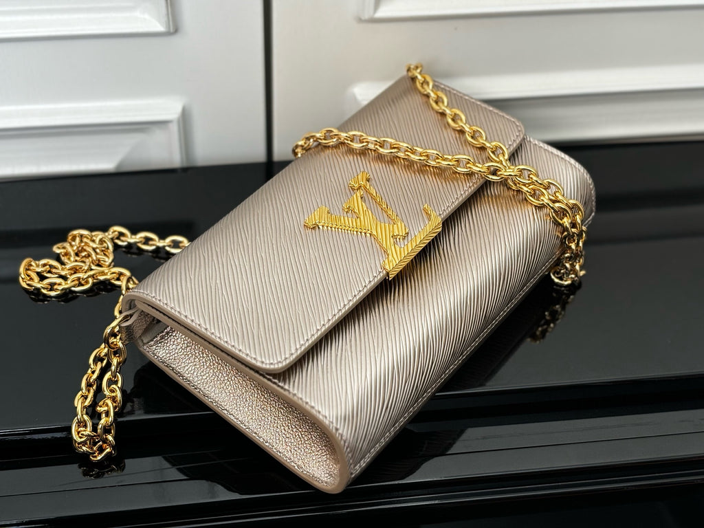 Textured beige crossbody bag with gold chain and LV-style logo on flap
