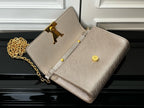 Beige textured bag open view with gold hardware, chain strap, logo detail