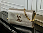 Louis Vuitton LV logo shoulder bag with gold chain strap, textured beige leather