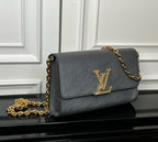 Louis Vuitton flap crossbody bag in dark blue-gray with gold LV monogram and chain strap