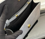 Louis Vuitton bag interior with black lining and small gold snap details