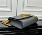 Louis Vuitton flap crossbody bag in light blue-gray, side view with gold chain strap