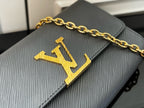 Louis Vuitton flap bag in light blue-gray with gold LV monogram detail