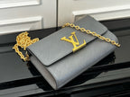 Louis Vuitton flap crossbody bag in light blue-gray with gold LV monogram and chain strap