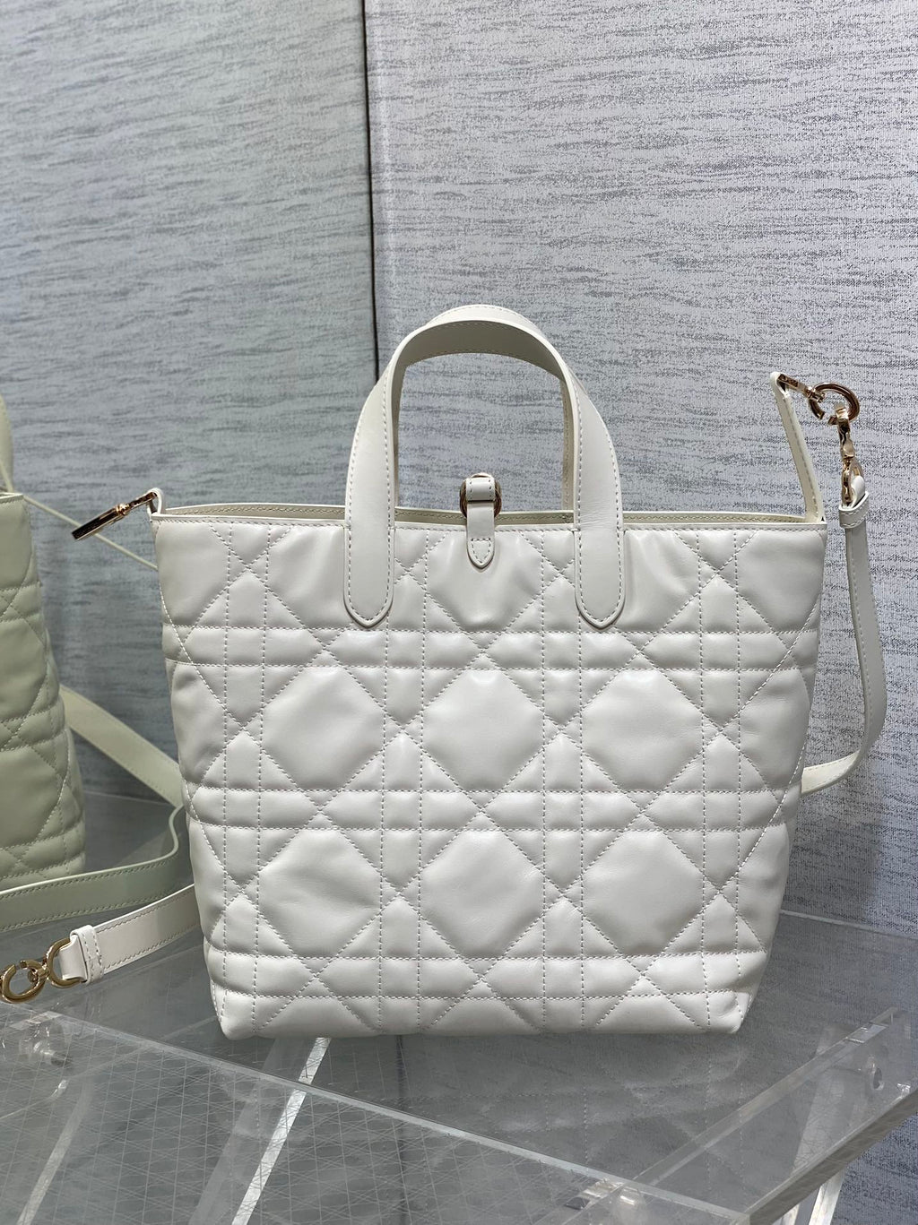 Dior quilted white tote bag with top handle and adjustable crossbody strap