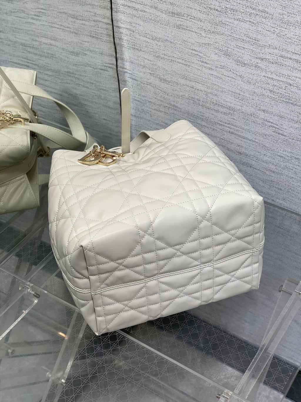 Dior quilted white barrel bag with top handle and gold clasp