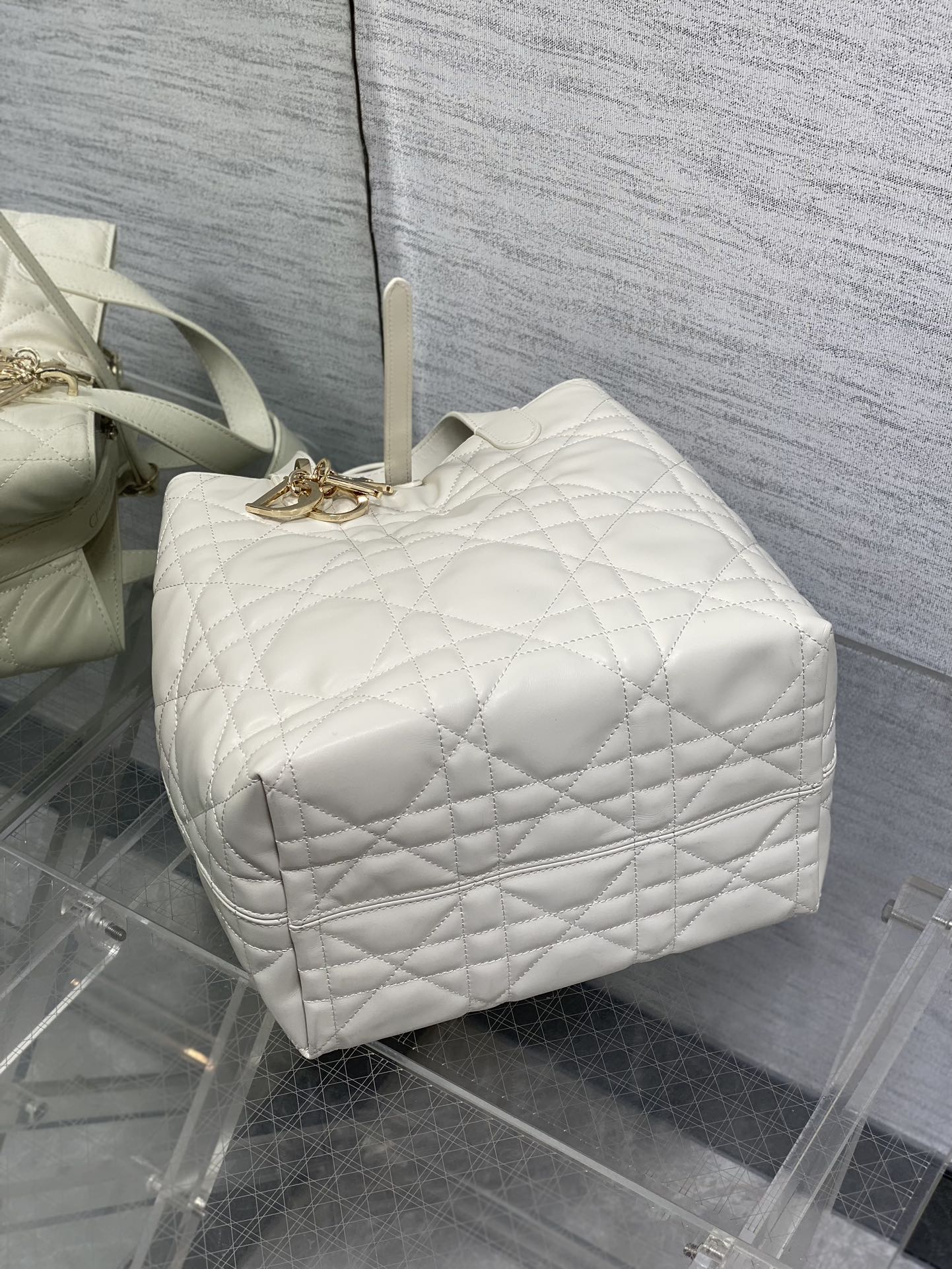 Dior quilted white barrel bag with top handle and gold clasp