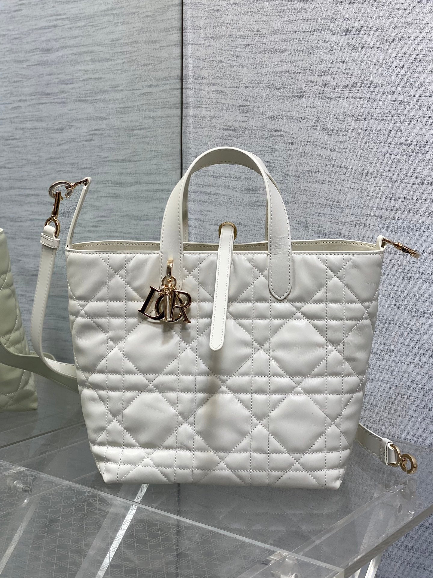 Dior quilted white tote bag with shoulder strap and gold hardware