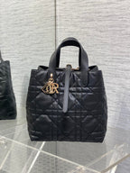 Dior quilted leather tote bag, black with gold logo charm and top handle