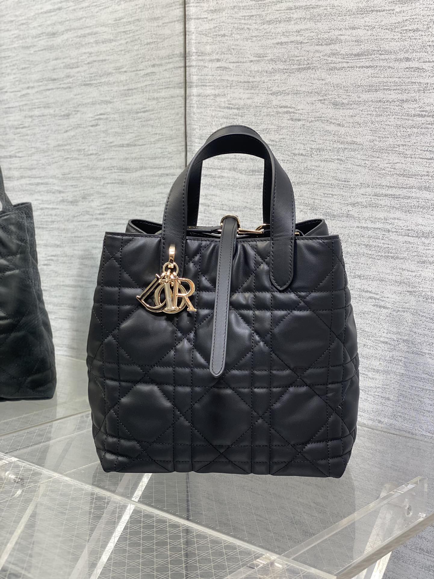 Dior quilted leather tote bag, black with gold logo charm and top handle