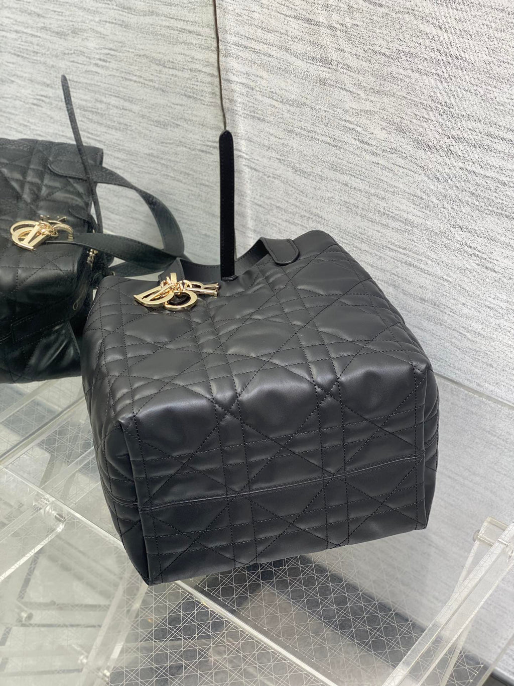 Dior quilted leather top handle bag, black with gold logo charm