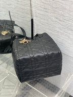 Dior quilted leather top handle bag, black with gold logo charm