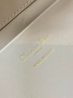 Dior cream leather branding label reading “Christian Dior” and “MADE IN FRANCE”