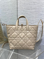 Dior cream quilted handbag with top handles and side shoulder strap, front emblem charm