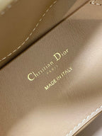 Beige Dior branding on leather strap: 'Christian Dior Paris, Made in Italy'