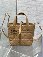 Dior quilted mini handbag with adjustable shoulder strap and gold-tone logo charm