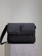 YSL bag with front flap and YSL logo, dark padded fabric, shoulder strap