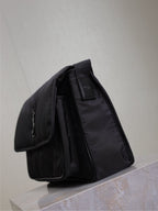 YSL bag with top handle and side pockets, dark nylon, structured padded shape