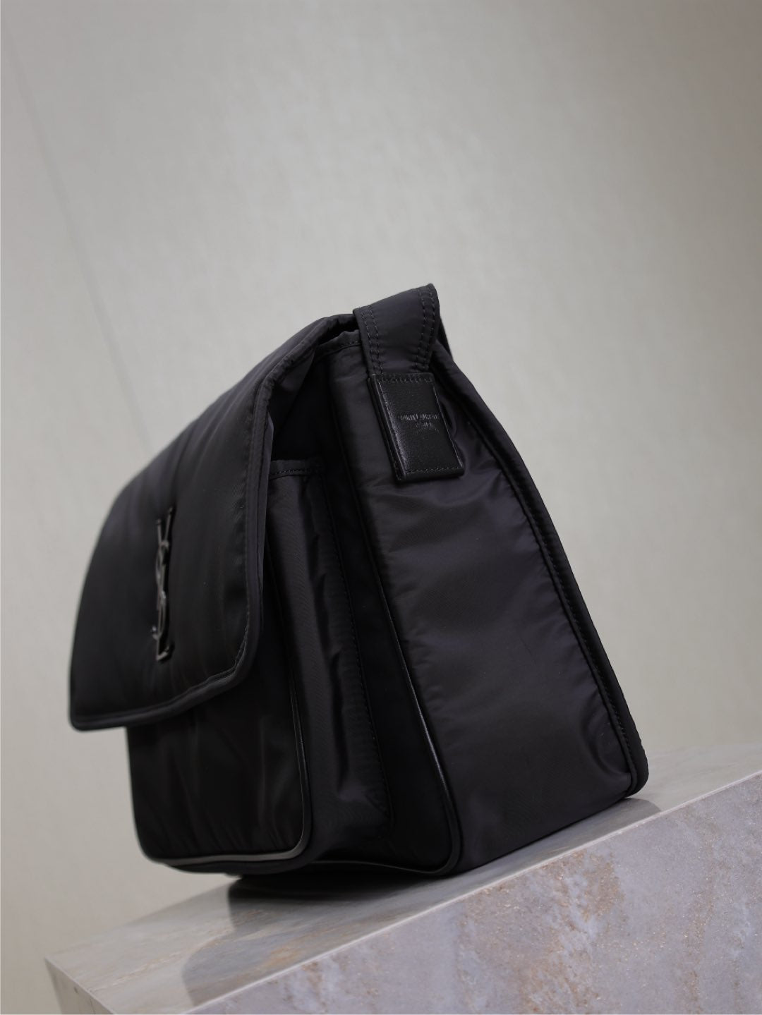 YSL bag with top handle and side pockets, dark nylon, structured padded shape