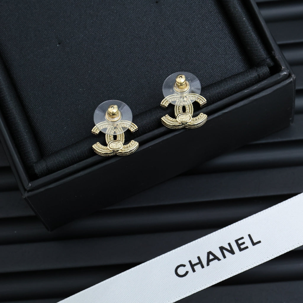 Chanel CC drop earrings with gold-tone hardware and clear stones in box