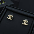 Pair of Chanel CC stud earrings with gold-tone setting and clear stones