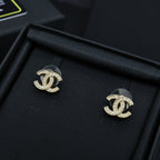 Pair of Chanel CC stud earrings with gold-tone setting and clear stones