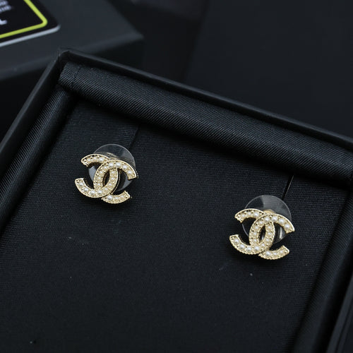 Pair of Chanel CC stud earrings with gold-tone setting and clear stones