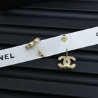 Chanel CC earrings on white ribbon with gold-tone detailing