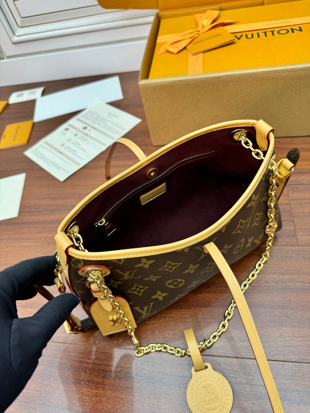 Louis Vuitton monogram mini bag open to purple interior, chain strap and leather trim