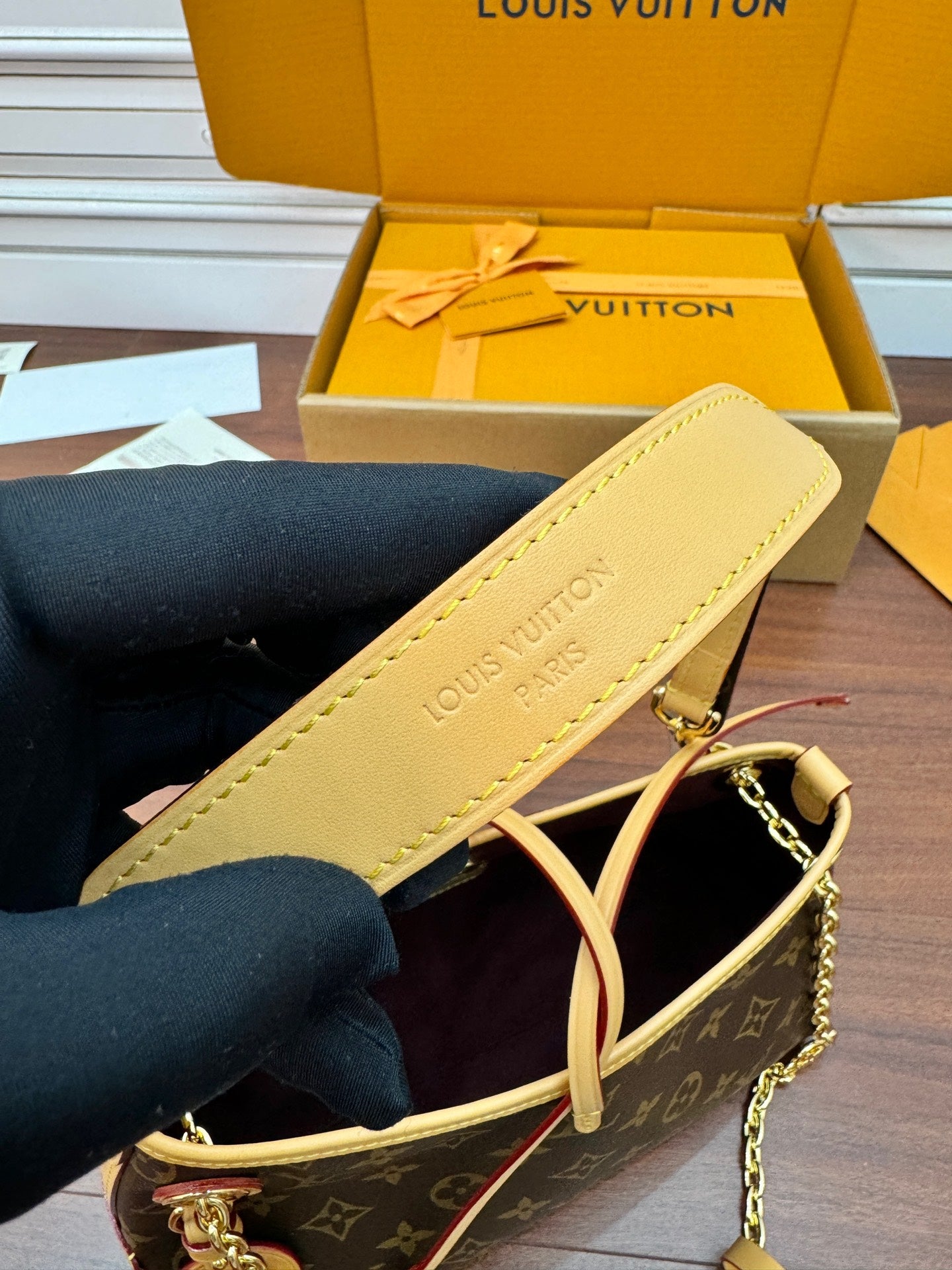 Louis Vuitton monogram mini bag with cream leather strap and gold chain hardware