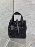 Black Dior mini bag with top handles and front monogram charm