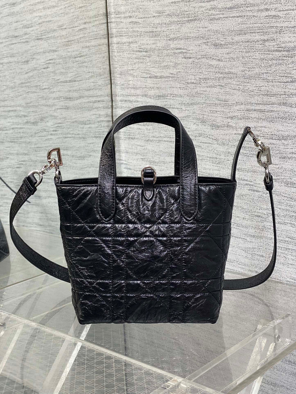 Black Dior mini tote with top handles and side crossbody straps