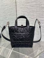 Black Dior mini tote with top handles and side crossbody straps