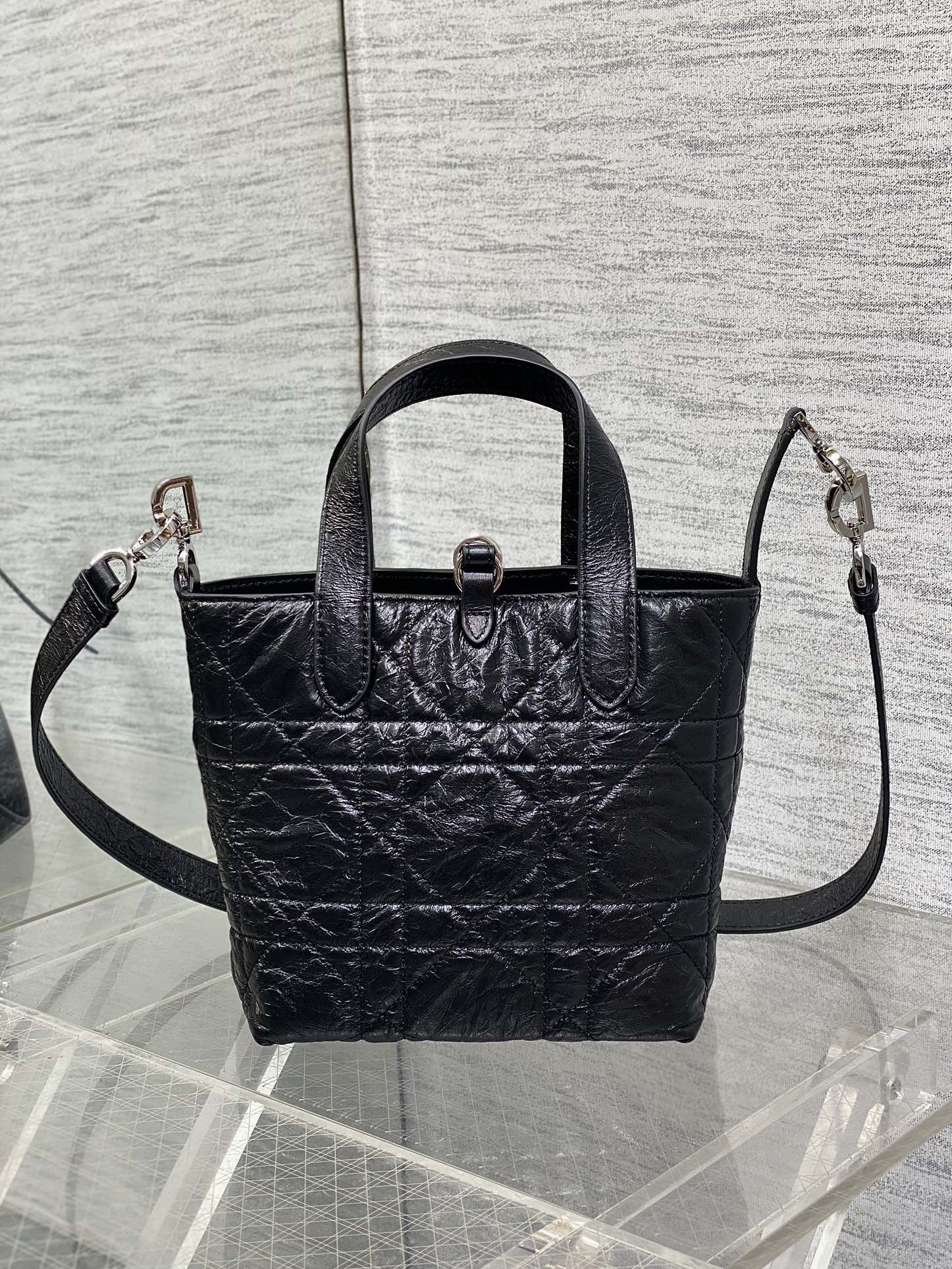 Black Dior mini tote with top handles and side crossbody straps