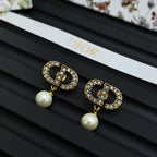 Dior logo stud earrings with crystal border and white pearl drop