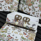 Dior logo stud earrings with crystal halo and white pearl drop