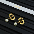 Dior logo earrings with gold-tone backs and white pearl drops
