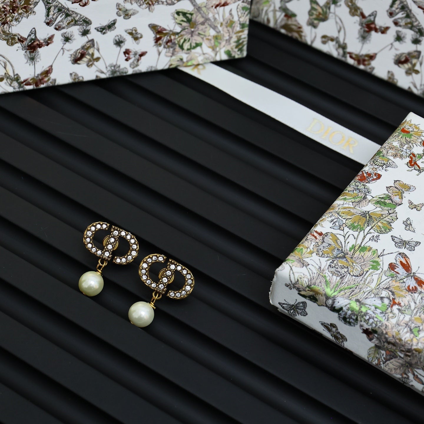 Dior logo drop earrings with crystal trim and white pearl drops