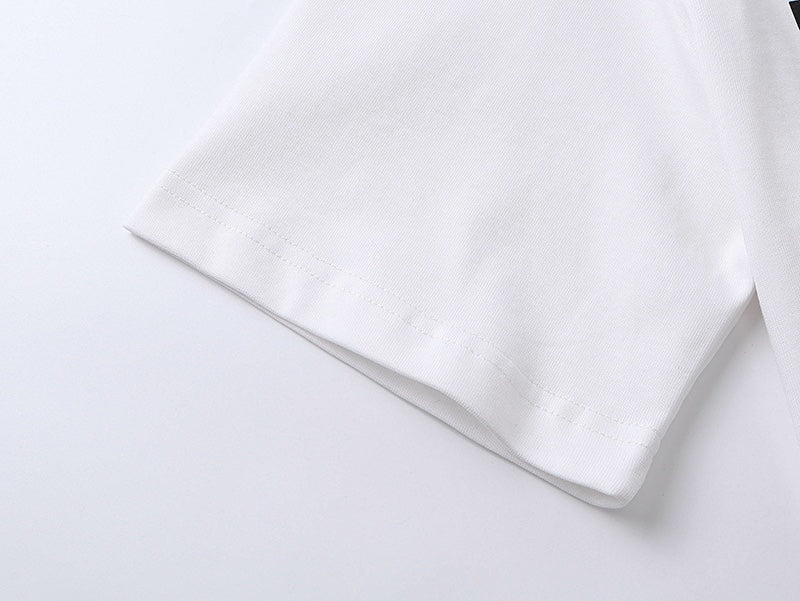 White T-shirt sleeve hem and side seam close-up