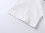 White T-shirt sleeve hem and side seam close-up