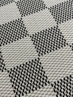 Louis Vuitton check-pattern knit T-shirt fabric close-up with staggered dotted texture