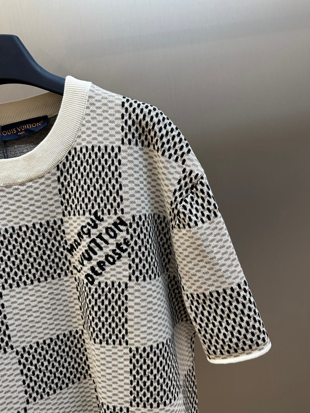 Louis Vuitton check-pattern short-sleeve knit T-shirt close-up with logo lettering