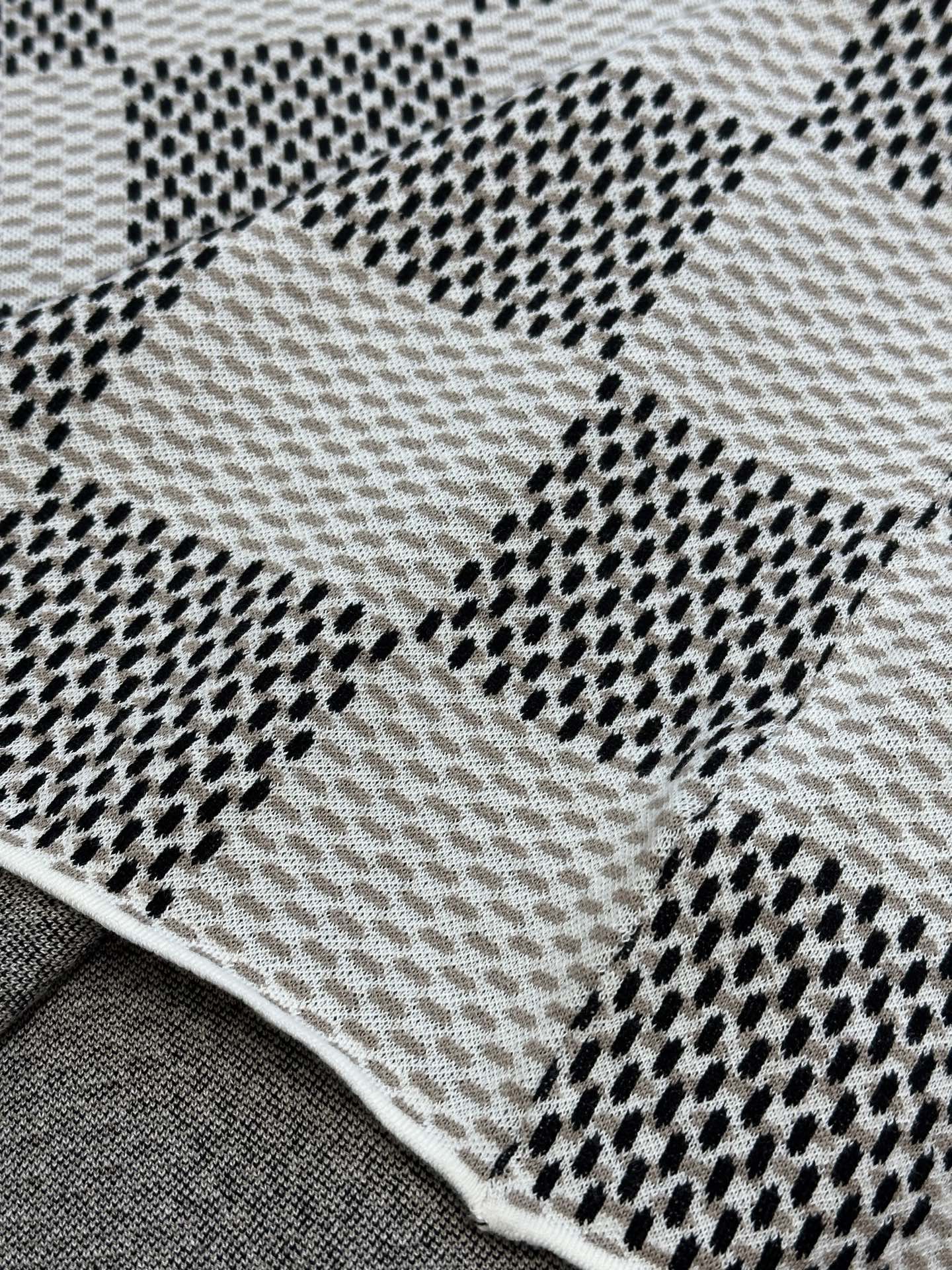 Louis Vuitton check-pattern knit T-shirt fabric close-up with dotted black accents