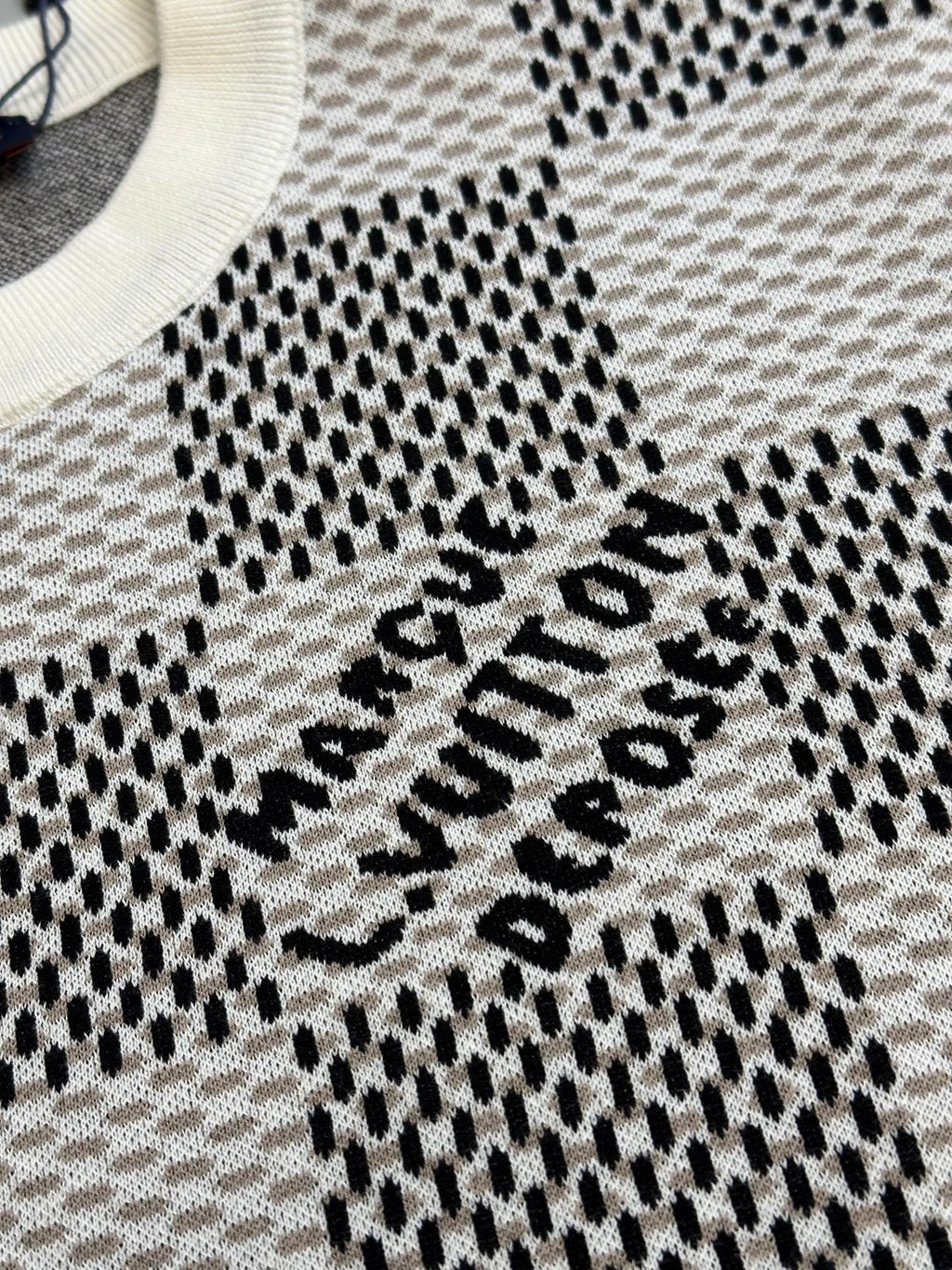 Louis Vuitton check-pattern knit T-shirt with black-and-white logo text on chest