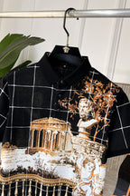 Versace short-sleeve shirt close-up, black with white grid lines and gold baroque artwork