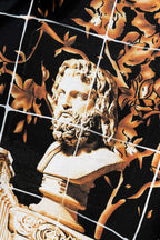 Versace short-sleeve shirt print close-up, black with gold face artwork and leaf motifs