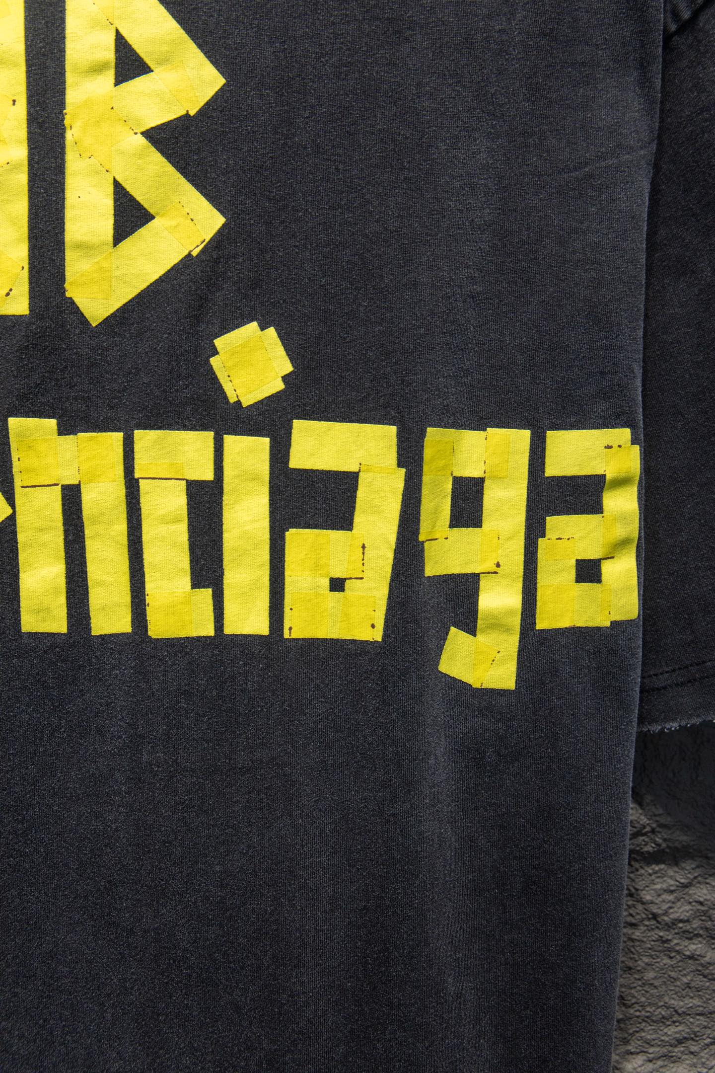 Balenciaga black T-shirt sleeve with yellow geometric logo print