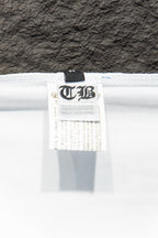 White T-shirt inside label tag with care information and size details